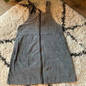 Grey corduroy type material, zipper down front.